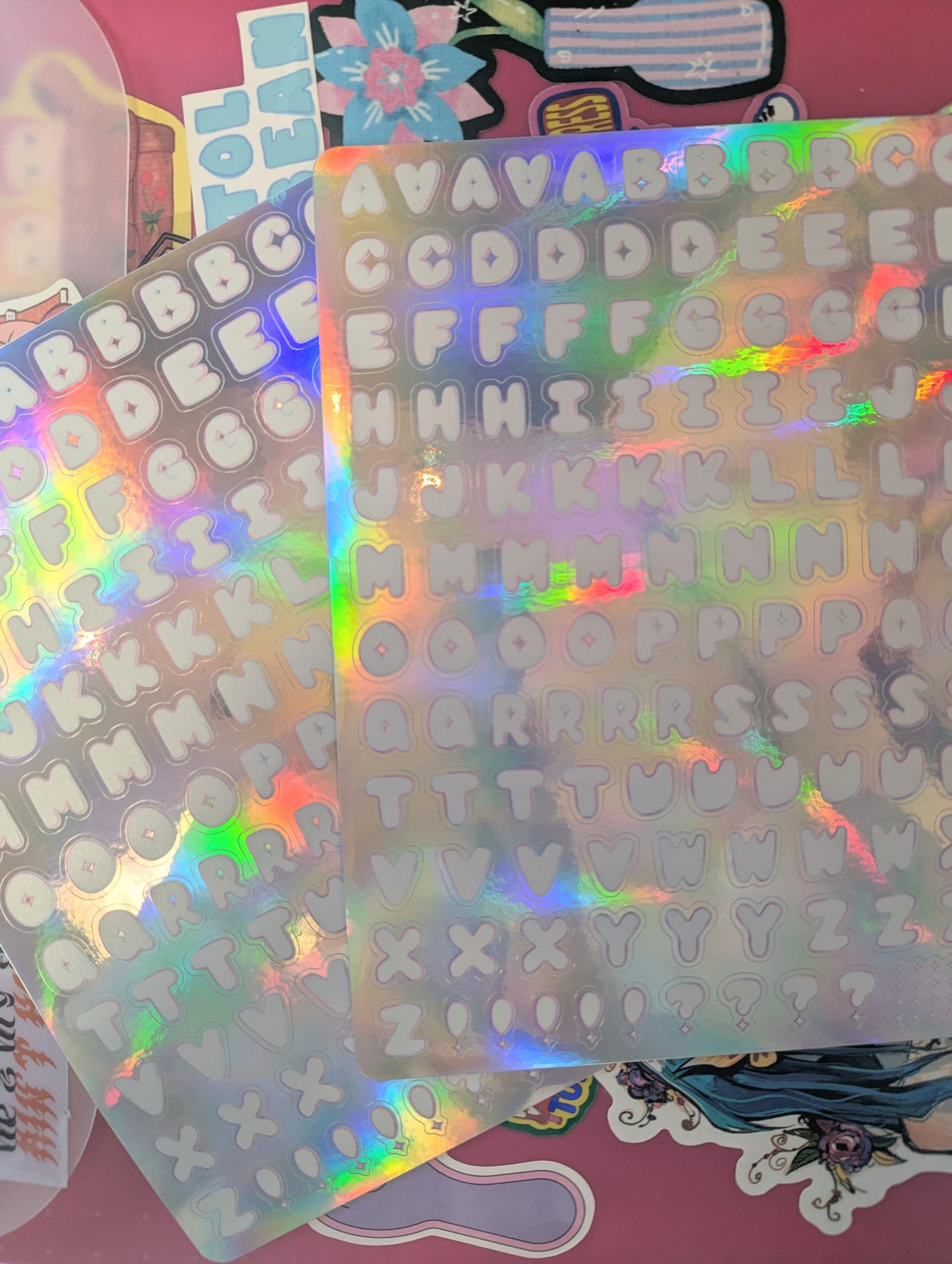 Holographic letter sticker sheets